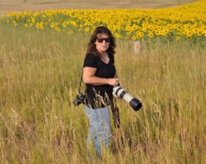 Admin K.S. Brooks with sunflowers by janice viens