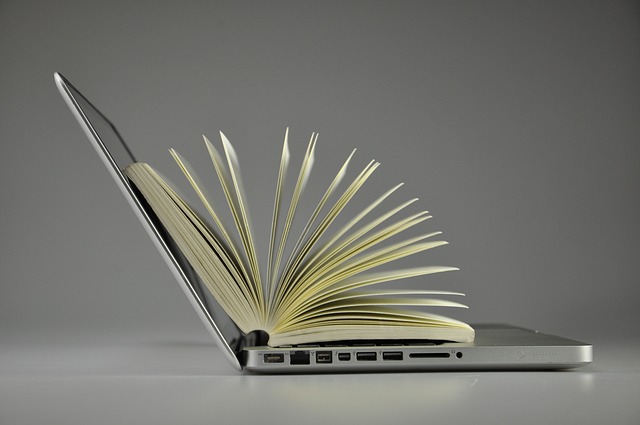 book inside a laptop courtesy of Pixabay.com