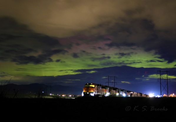 train at night under aurora borealis flash fiction writing prompt photo