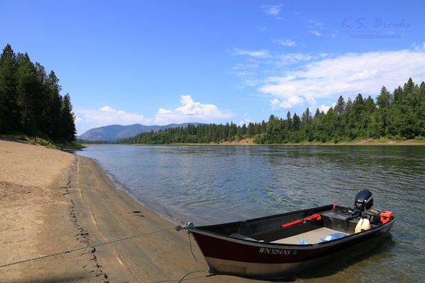 boat on a sandy shore on the columbia river in washington state by k.s. brooks