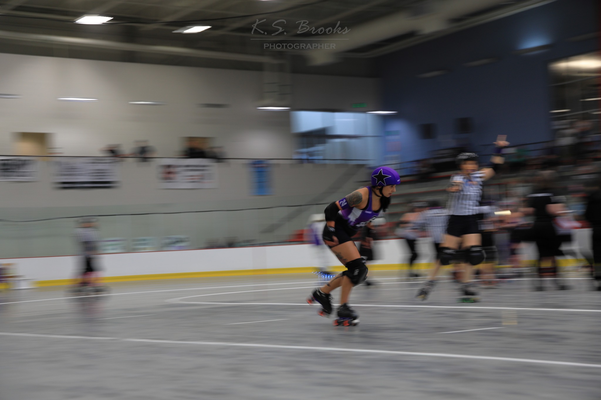 Roller derby skater speeding by photo by K.S. Brooks