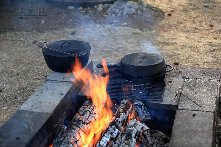 cast iron pots cooking on an open fire by k.s. brooks